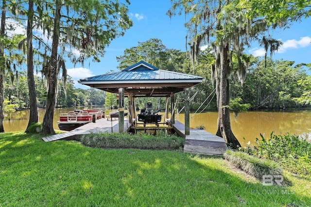 dock area featuring a yard and a water view