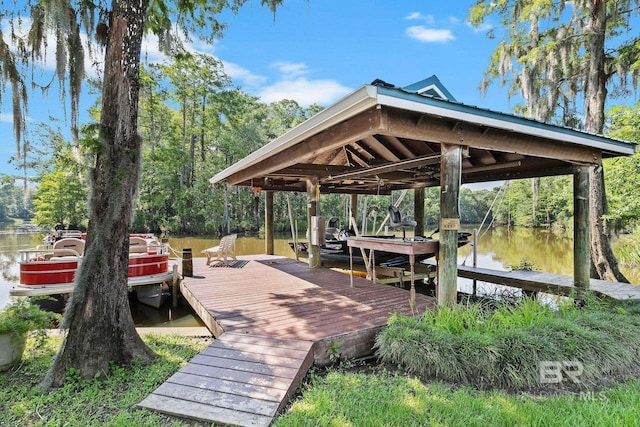 view of dock with a water view