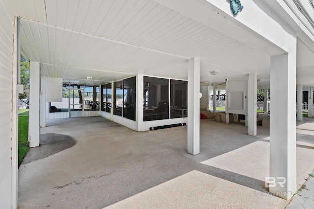 view of patio featuring a sunroom