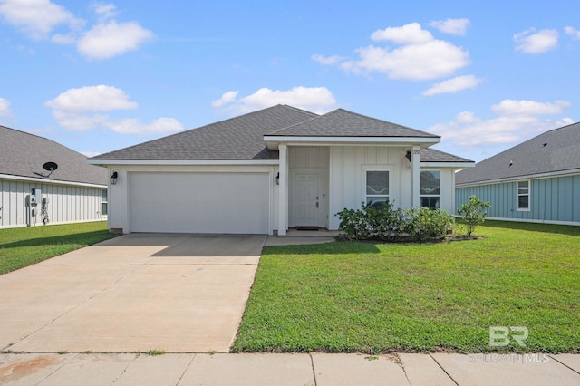 view of front of home with a garage and a front yard