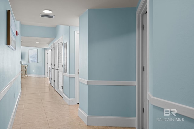 28103 Perdido Beach Blvd Unit B 516, Orange Beach, AL 36561 - hallway with tile patterned floors and baseboards