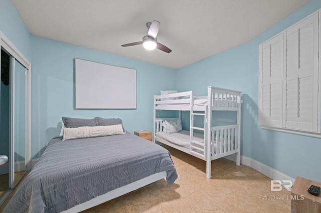 28103 Perdido Beach Blvd Unit B 516, Orange Beach, AL 36561 - bedroom with baseboards, a ceiling fan, and a closet