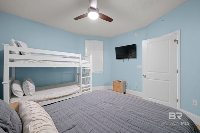 28103 Perdido Beach Blvd Unit B 516, Orange Beach, AL 36561 - bedroom with baseboards and ceiling fan