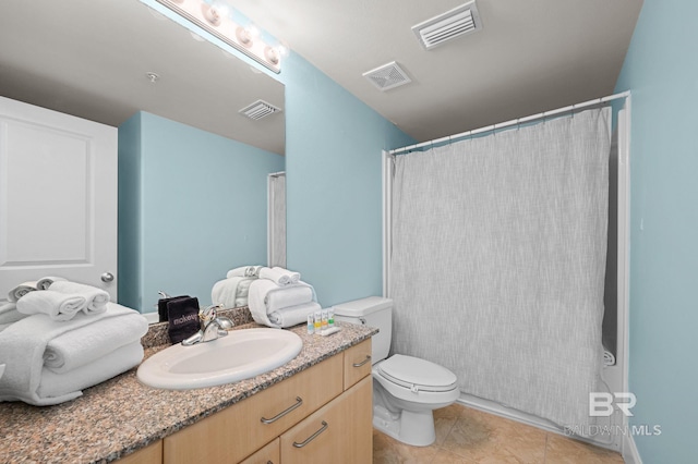 28103 Perdido Beach Blvd Unit B 516, Orange Beach, AL 36561 - bathroom featuring vanity, toilet, a shower with shower curtain, and tile patterned flooring