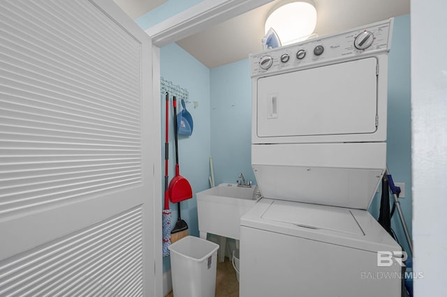 28103 Perdido Beach Blvd Unit B 516, Orange Beach, AL 36561 - laundry room with stacked washer and clothes dryer