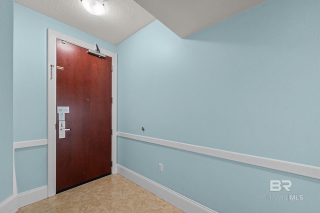 28103 Perdido Beach Blvd Unit B 516, Orange Beach, AL 36561 - entryway featuring baseboards and a textured ceiling