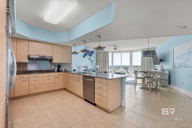 28103 Perdido Beach Blvd Unit B 516, Orange Beach, AL 36561 - kitchen featuring light brown cabinets, dishwasher, a peninsula, a sink, and dark countertops