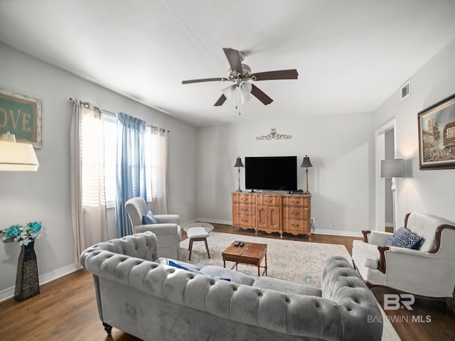 living room with hardwood / wood-style flooring and ceiling fan