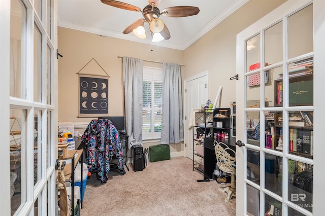 carpeted office space featuring ceiling fan, crown molding, and french doors