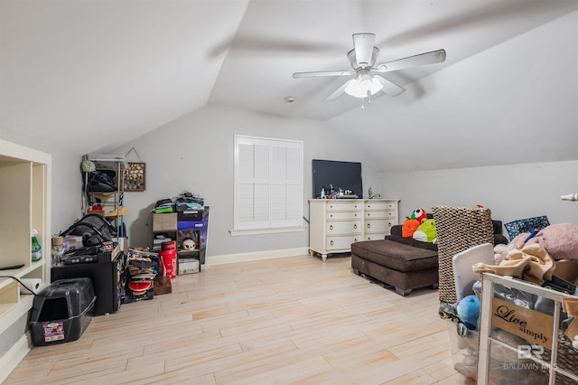 interior space with light hardwood / wood-style floors, ceiling fan, and lofted ceiling