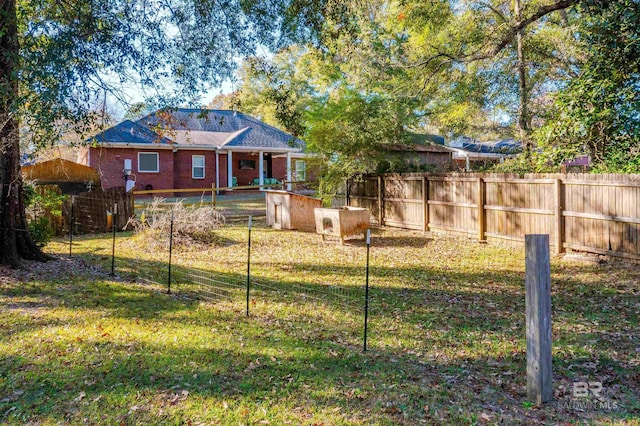 3340 Deer Track Dr, Semmes, AL 36575 - rear view of property with brick siding