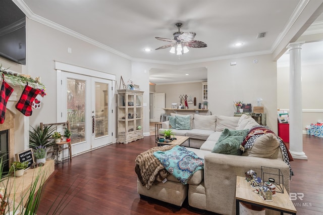 living room with dark hardwood / wood-style floors, crown molding, and french doors