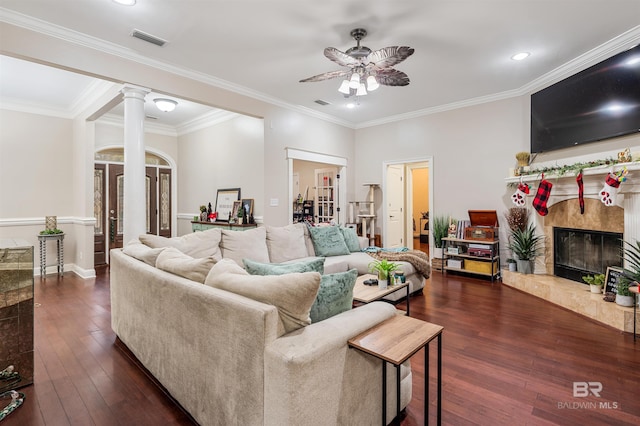 3340 Deer Track Dr, Semmes, AL 36575 - living room with decorative columns, a premium fireplace, ceiling fan, dark wood-type flooring, and crown molding