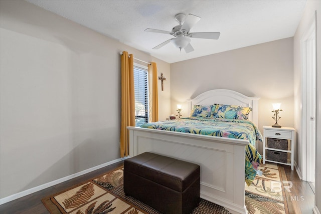 bedroom with ceiling fan and wood-type flooring