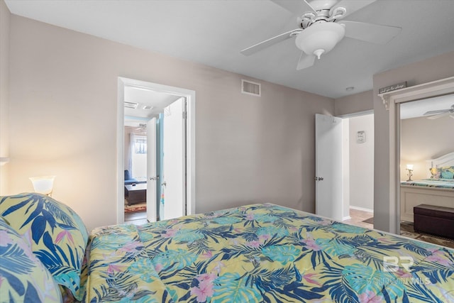 bedroom featuring ceiling fan and ensuite bathroom