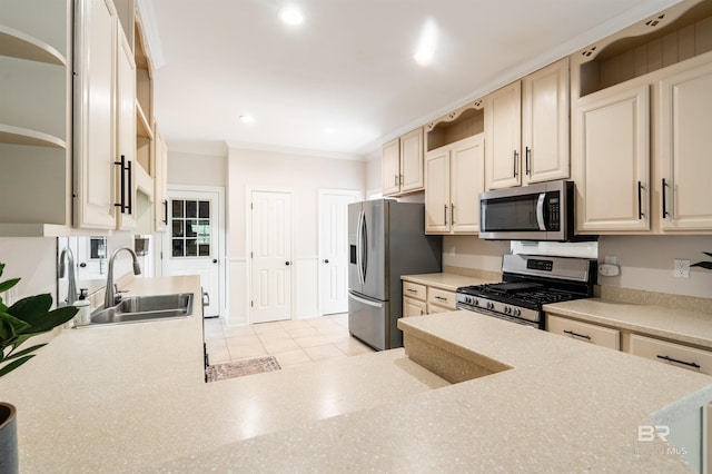 kitchen featuring appliances with stainless steel finishes, sink, light tile patterned floors, and crown molding