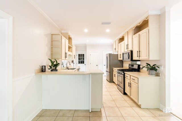 kitchen featuring sink, crown molding, stainless steel appliances, light tile patterned flooring, and kitchen peninsula