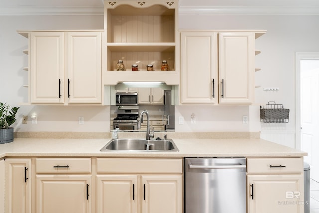 kitchen featuring sink, ornamental molding, and stainless steel appliances