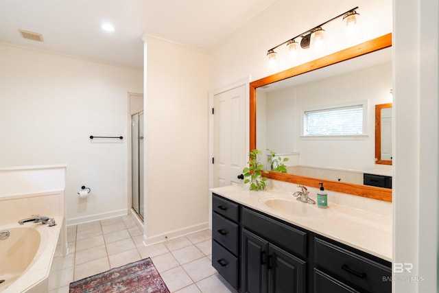 bathroom with vanity, tile patterned floors, and separate shower and tub