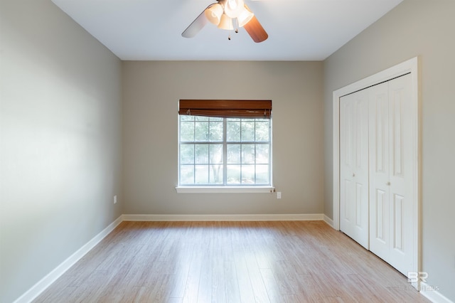 unfurnished bedroom with a closet, ceiling fan, and light hardwood / wood-style floors