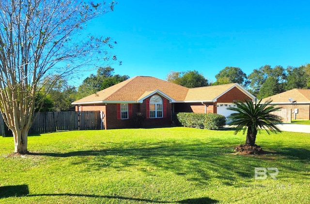 single story home featuring a front lawn and a garage