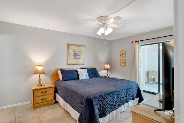 tiled bedroom with ceiling fan and access to outside