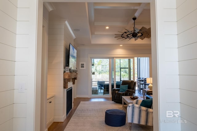 living room featuring light wood-style flooring, recessed lighting, coffered ceiling, a fireplace, and beam ceiling