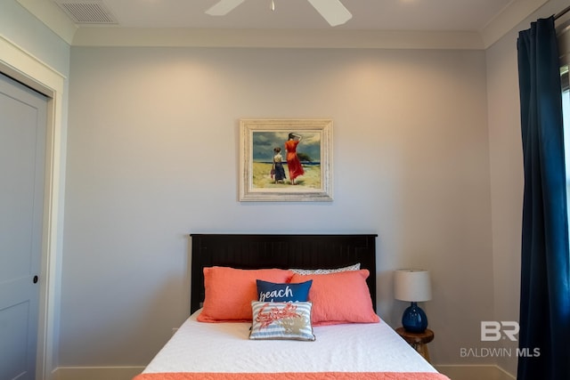 bedroom with ceiling fan and visible vents