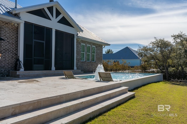 view of pool with a patio area, a fenced in pool, fence, and a lawn