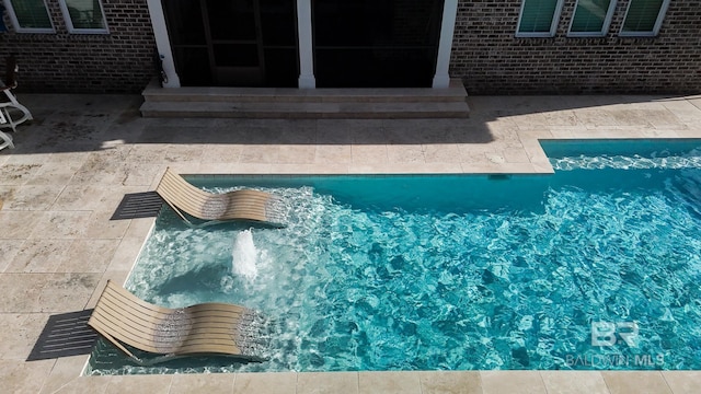 pool with a patio