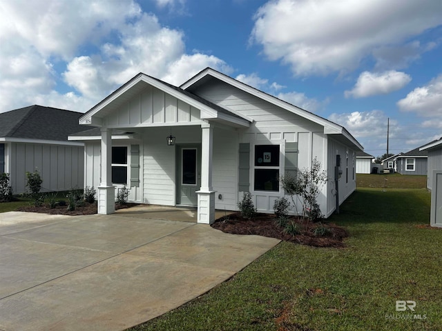 view of front of property with a front yard and a porch