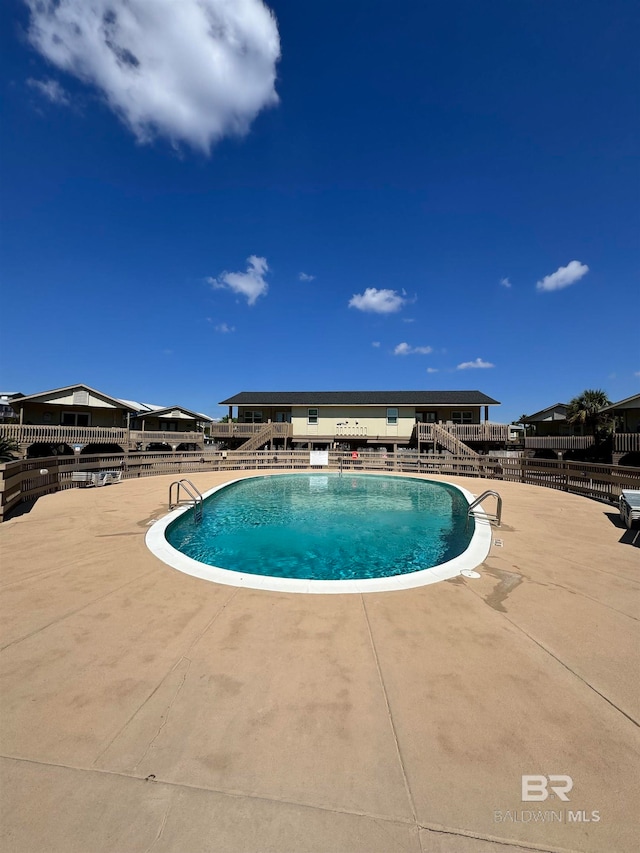 view of swimming pool featuring a patio