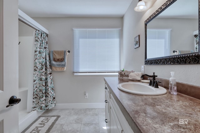 4209 Antigua Ct, Orange Beach, AL 36561 - bathroom with baseboards, shower / bath combination with curtain, tile patterned flooring, and vanity