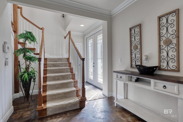 4209 Antigua Ct, Orange Beach, AL 36561 - foyer featuring concrete floors, plenty of natural light, stairs, and crown molding