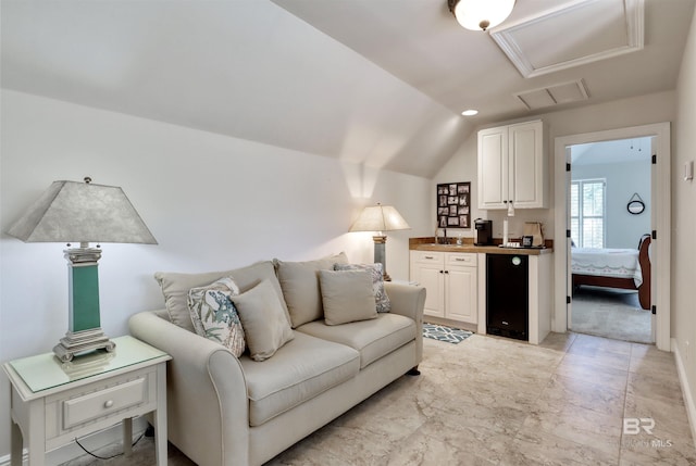 4209 Antigua Ct, Orange Beach, AL 36561 - living area with lofted ceiling, visible vents, marble finish floor, and attic access