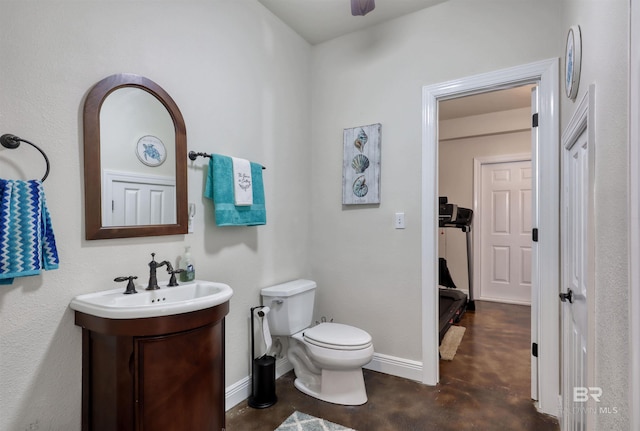 4209 Antigua Ct, Orange Beach, AL 36561 - half bath with finished concrete flooring, baseboards, toilet, and vanity