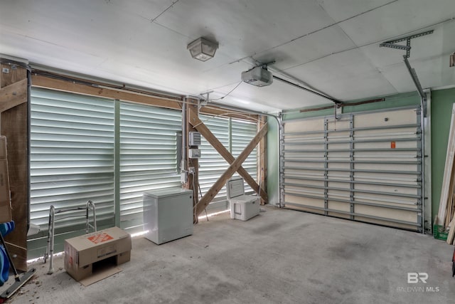 4209 Antigua Ct, Orange Beach, AL 36561 - garage featuring a garage door opener and refrigerator