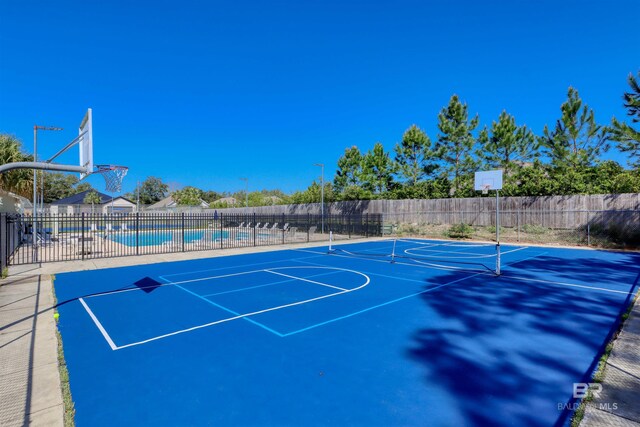 4209 Antigua Ct, Orange Beach, AL 36561 - view of basketball court featuring a community pool, community basketball court, and fence
