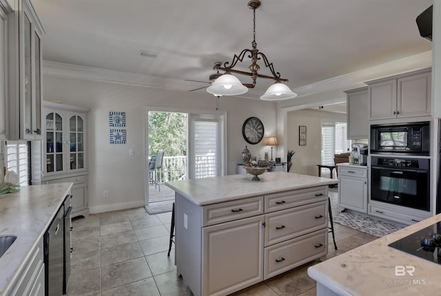 4209 Antigua Ct, Orange Beach, AL 36561 - kitchen featuring crown molding, pendant lighting, a breakfast bar, a center island, and black appliances