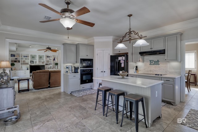 4209 Antigua Ct, Orange Beach, AL 36561 - kitchen featuring gray cabinets, under cabinet range hood, black appliances, and ceiling fan
