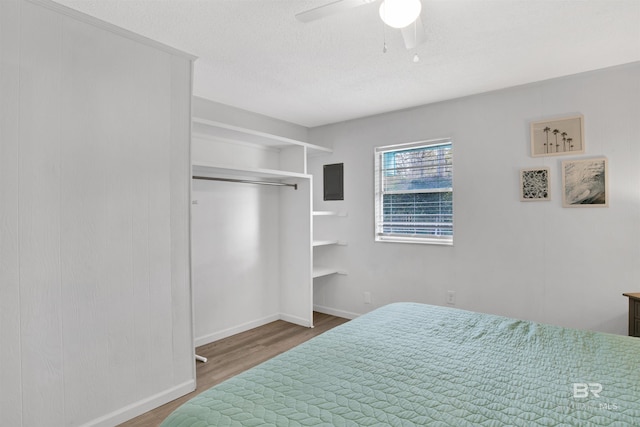 325 E 22nd Ave Unit 8, Gulf Shores, AL 36542 - bedroom featuring wood finished floors, baseboards, and a ceiling fan