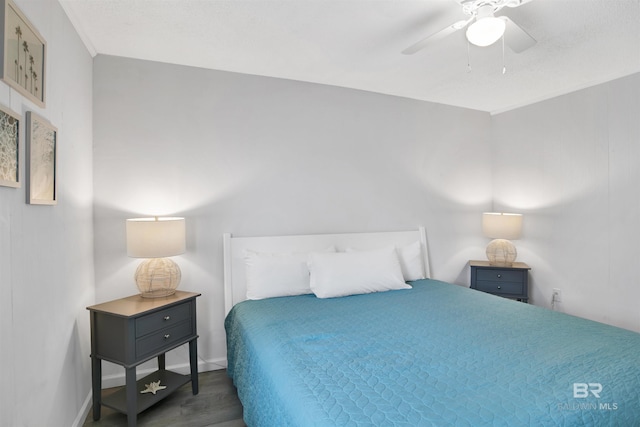 325 E 22nd Ave Unit 8, Gulf Shores, AL 36542 - bedroom featuring wood finished floors, baseboards, and ceiling fan