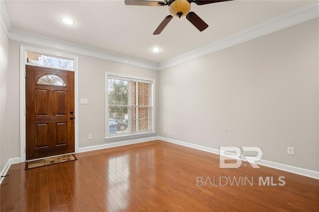 foyer entrance featuring crown molding, ceiling fan, and hardwood / wood-style flooring