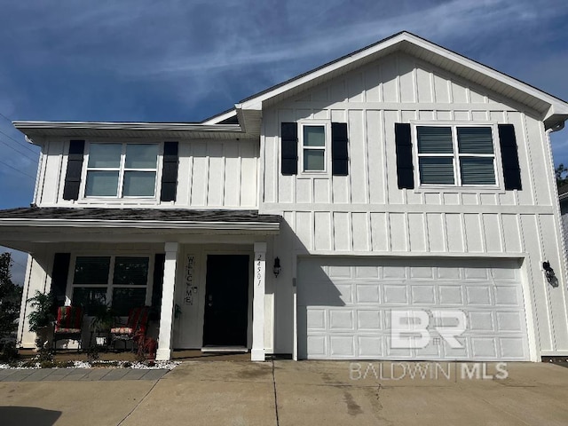 view of front facade with a garage, a porch, and board and batten siding