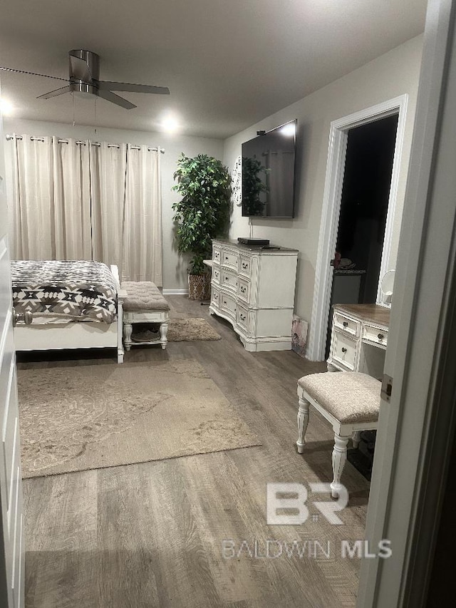 bedroom featuring wood finished floors