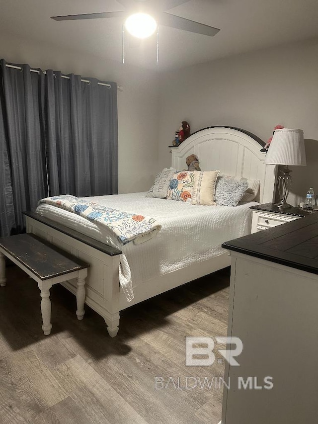 bedroom featuring ceiling fan and light wood finished floors