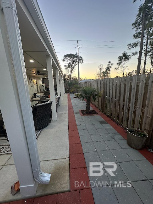 view of patio featuring fence