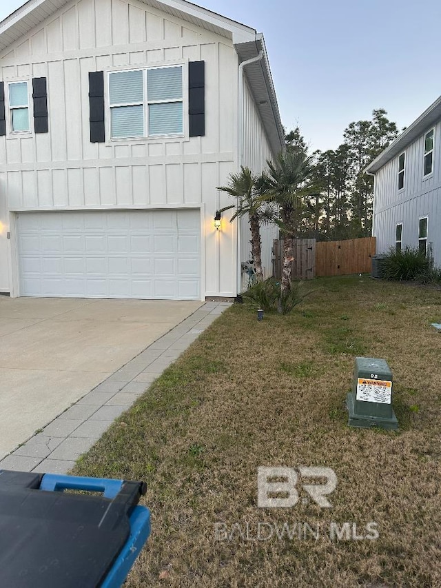 view of property exterior featuring board and batten siding, driveway, a garage, and a lawn