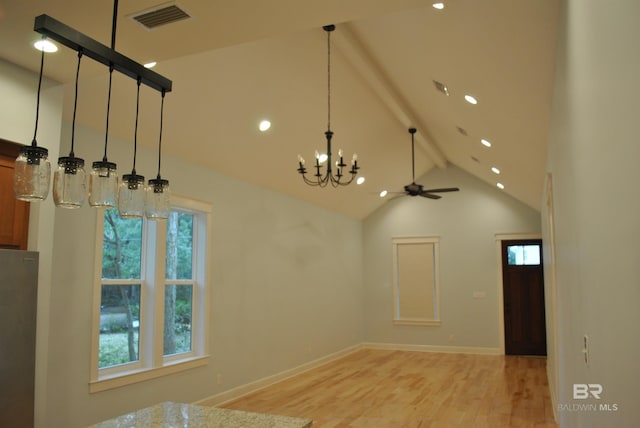 interior space with ceiling fan with notable chandelier, beam ceiling, light wood-type flooring, and high vaulted ceiling