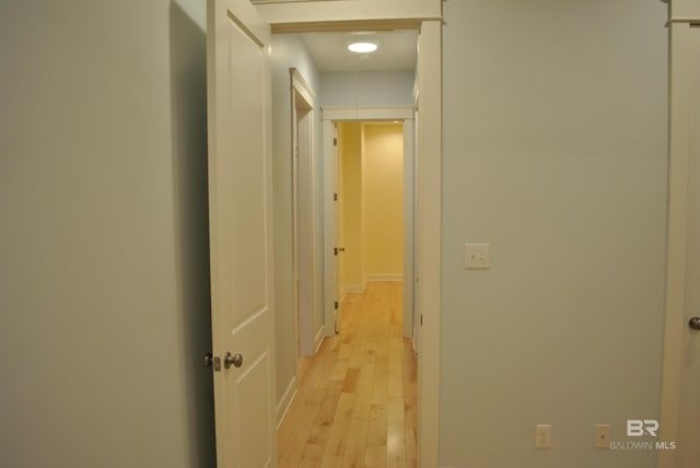 hall with light hardwood / wood-style floors